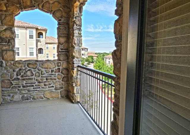 a view of a balcony with door