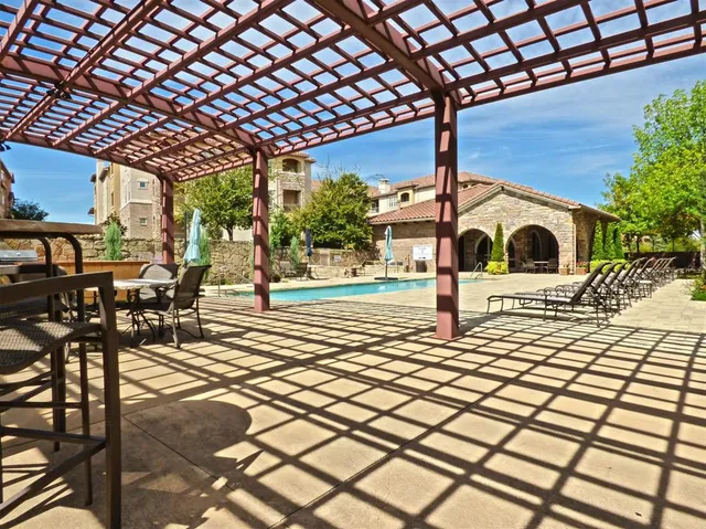 a view of a swimming pool with a patio
