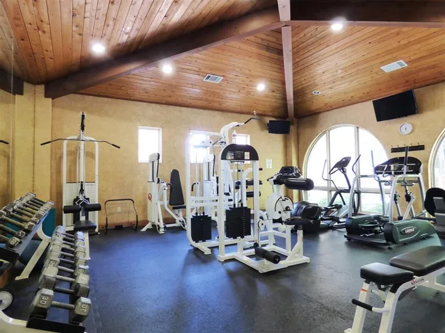 a room with lots of gym equipment