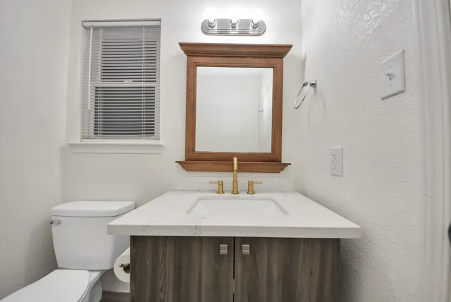 a bathroom with a sink and a toilet