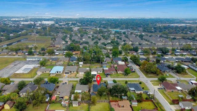 an aerial view of residential houses with outdoor space