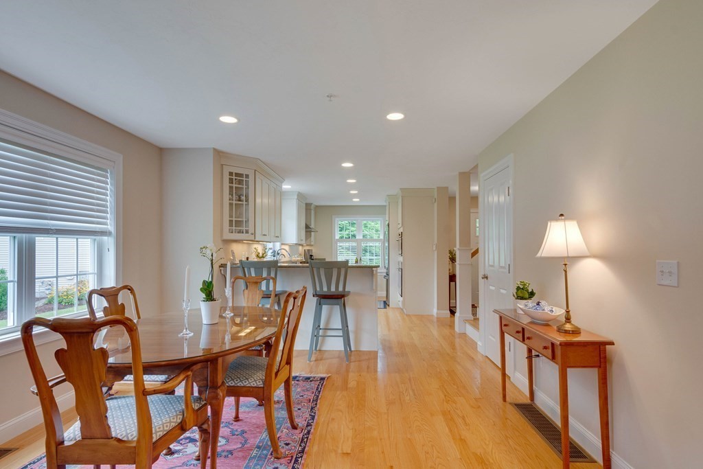 1138 Hill Road, Unit 4B Boxborough, MA 01719 - Photo 14 of 41 a view of a dining room with furniture and wooden floor