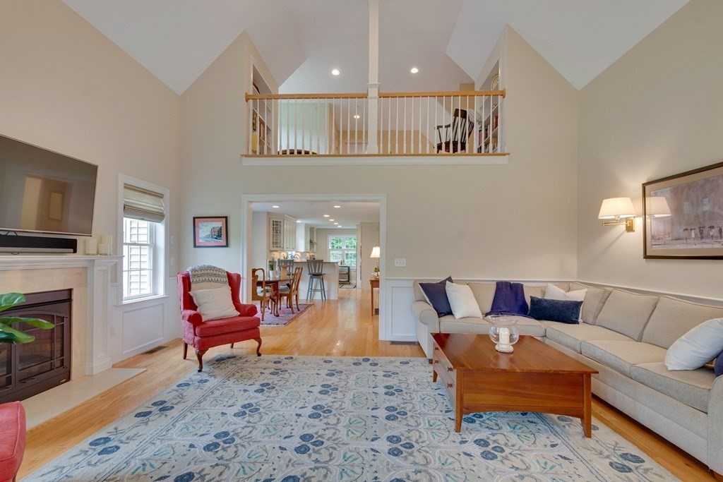 1138 Hill Road, Unit 4B Boxborough, MA 01719 - Photo 3 of 41 a living room with furniture and a fireplace