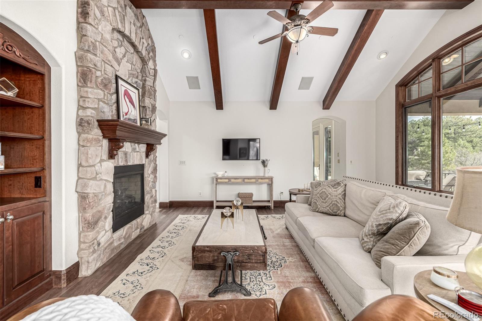 648 Ruby Trust Drive Castle Rock, CO 80108 - Photo 13 of 49 a living room with furniture fireplace and flat screen tv
