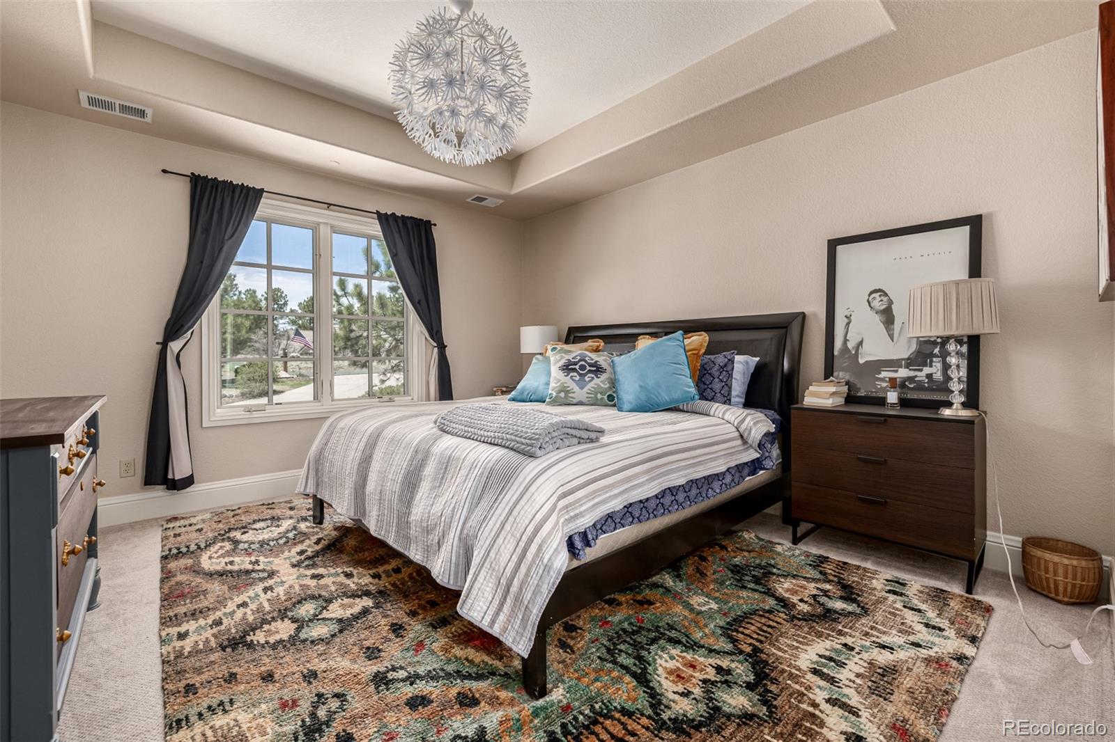 648 Ruby Trust Drive Castle Rock, CO 80108 - Photo 29 of 49 a bedroom with a bed and a window