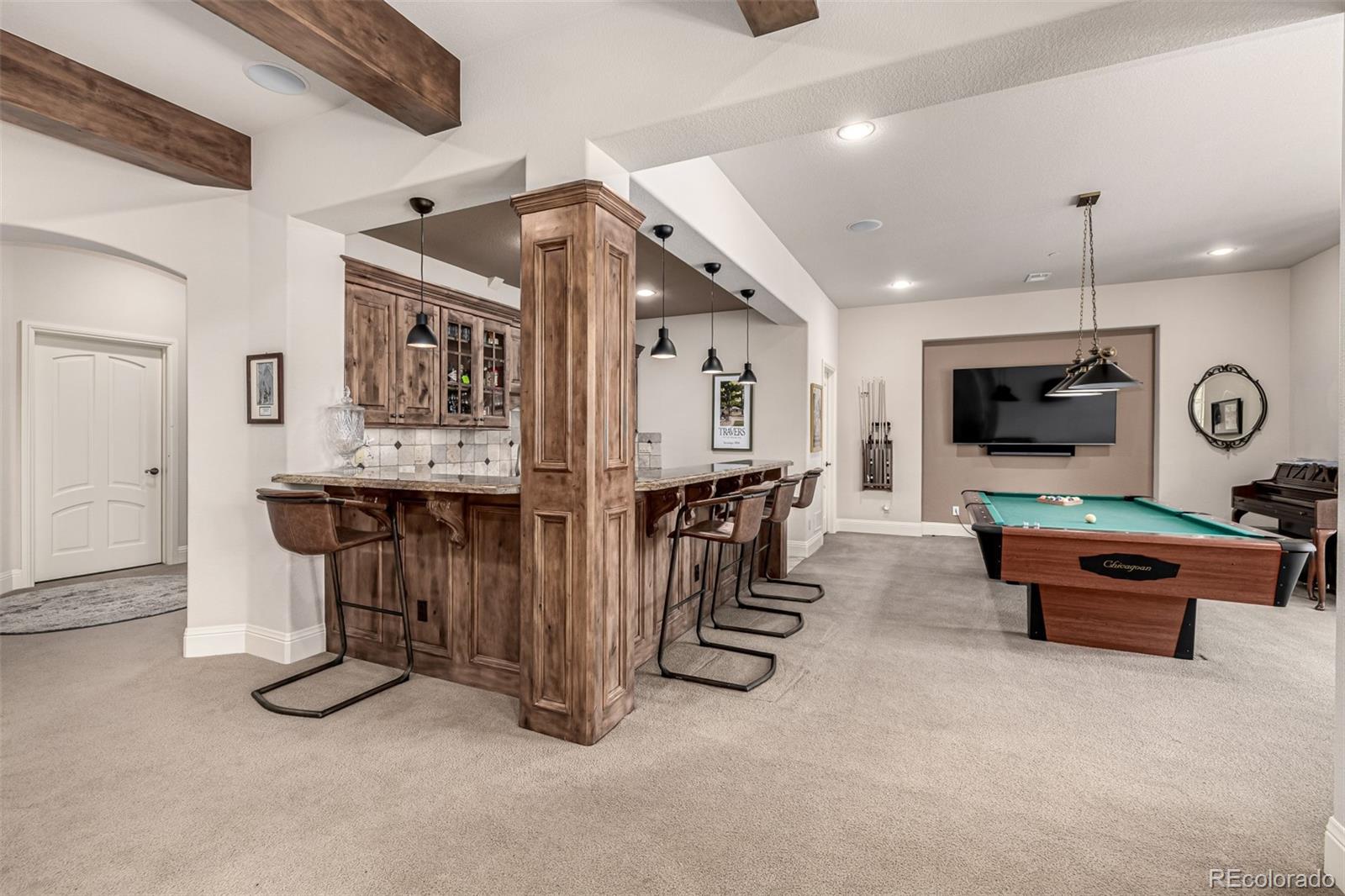 648 Ruby Trust Drive Castle Rock, CO 80108 - Photo 33 of 49 a view of a livingroom with furniture and a flat screen tv