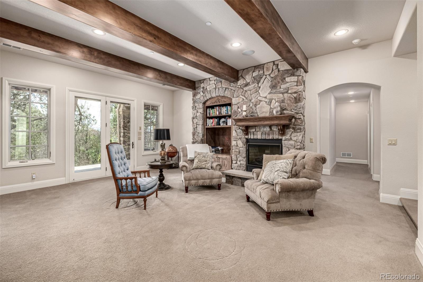 648 Ruby Trust Drive Castle Rock, CO 80108 - Photo 34 of 49 a living room with furniture and a fireplace