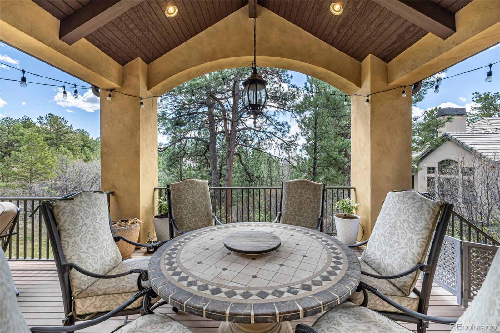 648 Ruby Trust Drive Castle Rock, CO 80108 - Photo 44 of 49 a view of a chairs and table in the patio
