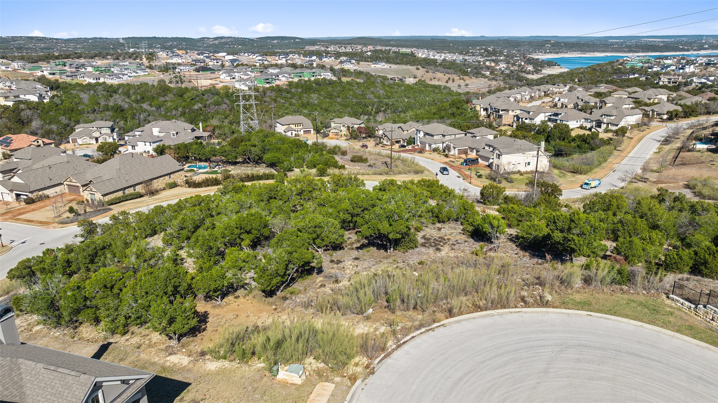 420 Lindale Cove Austin, TX 78738 - Photo 8 of 12 an aerial view of residential houses with outdoor space and trees