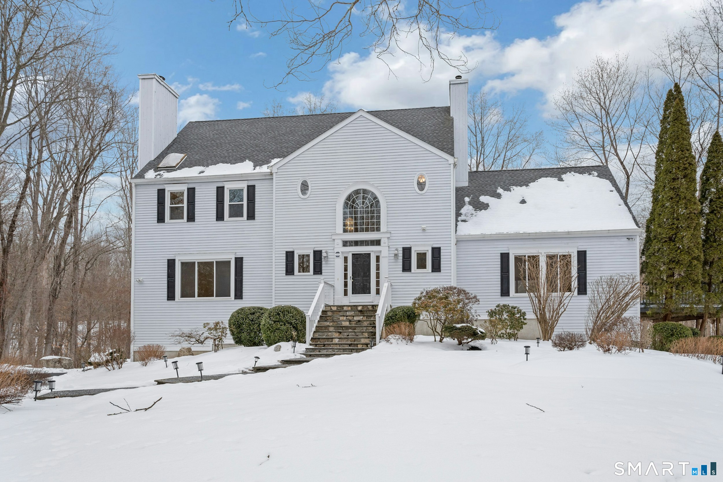 6 Morganti Court Ridgefield, CT 06877 - Photo 1 of 36 a front view of a house with a yard