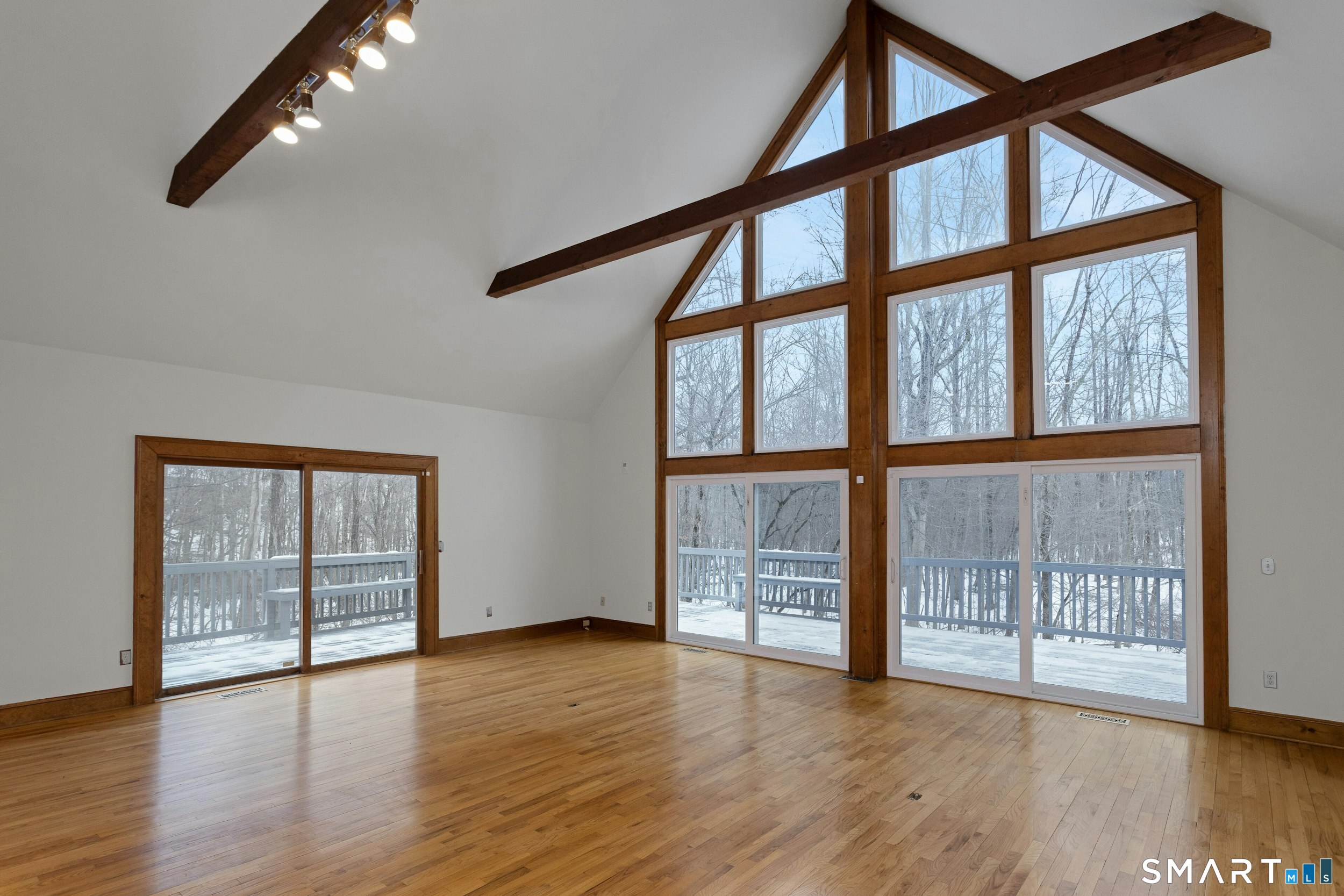6 Morganti Court Ridgefield, CT 06877 - Photo 14 of 36 wooden floor in an empty room with a window