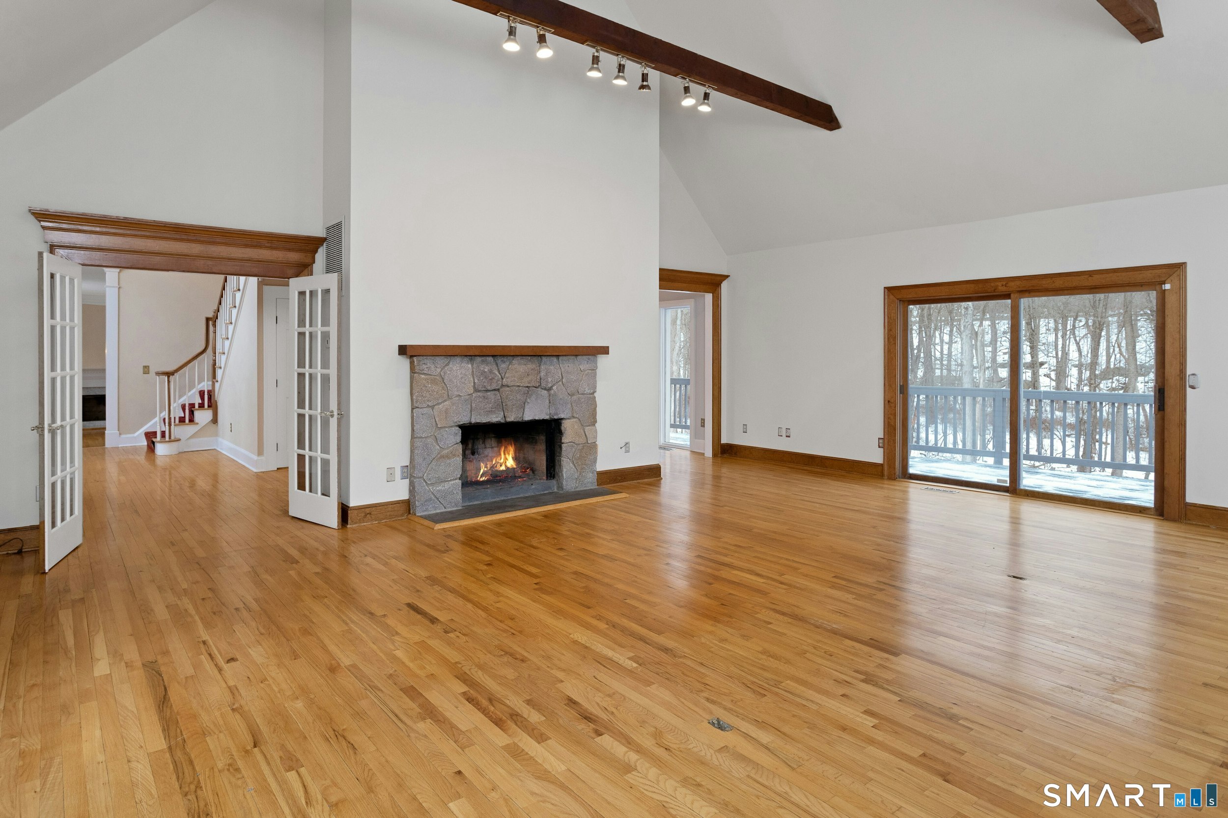 6 Morganti Court Ridgefield, CT 06877 - Photo 2 of 36 a view of an empty room with glass door and wooden floor