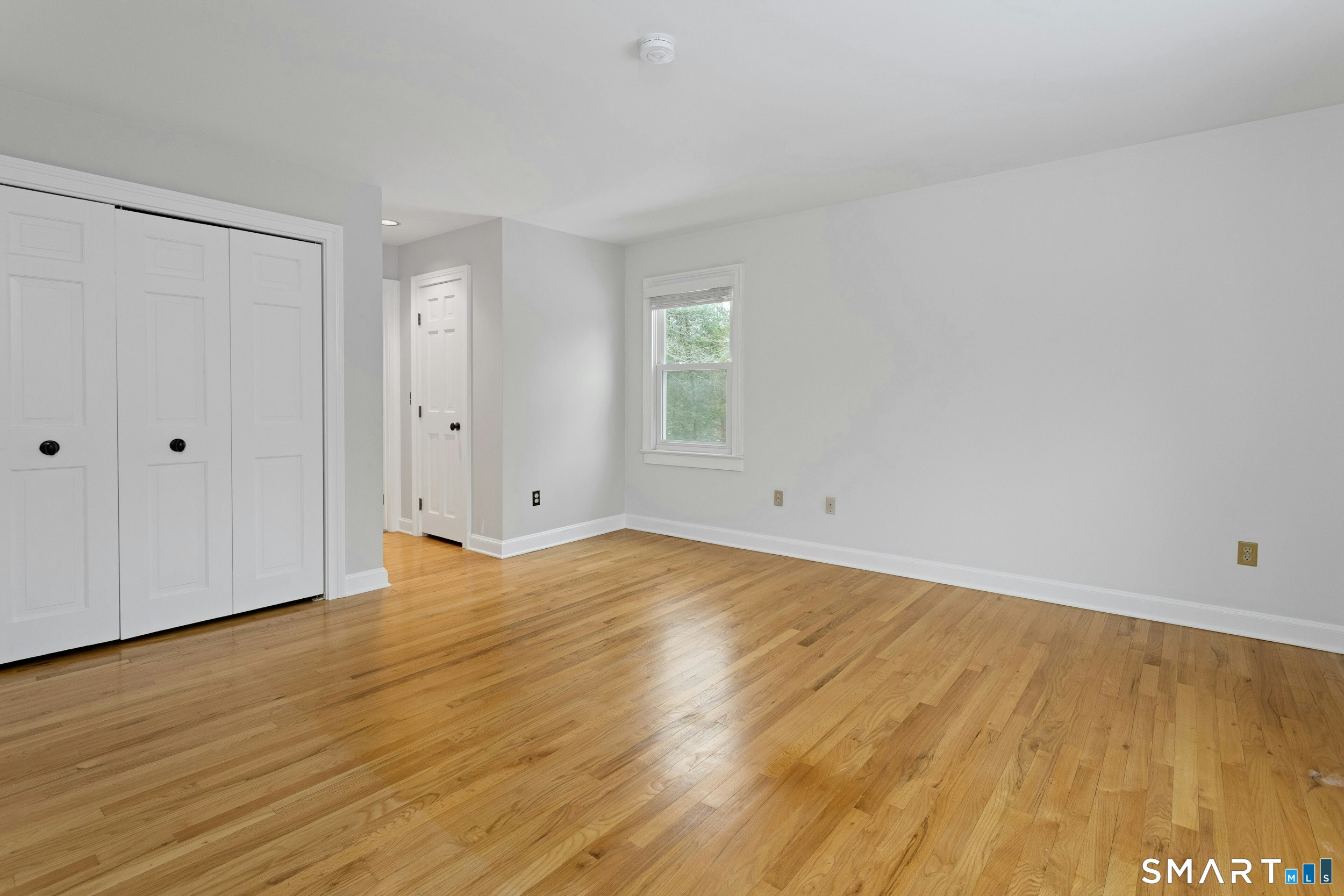 6 Morganti Court Ridgefield, CT 06877 - Photo 23 of 36 a view of empty room with wooden floor and fan