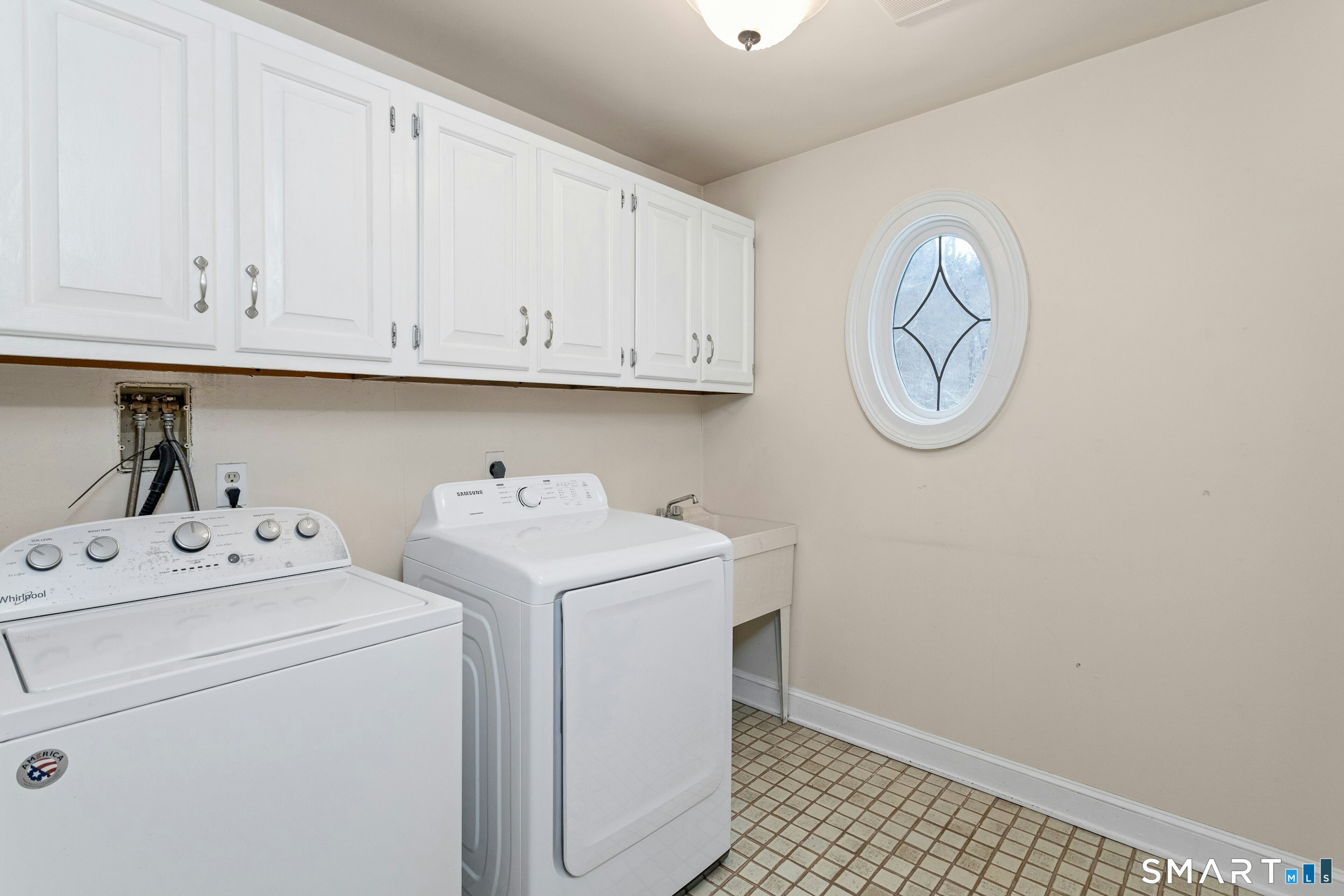 6 Morganti Court Ridgefield, CT 06877 - Photo 26 of 36 a utility room with dryer and washer
