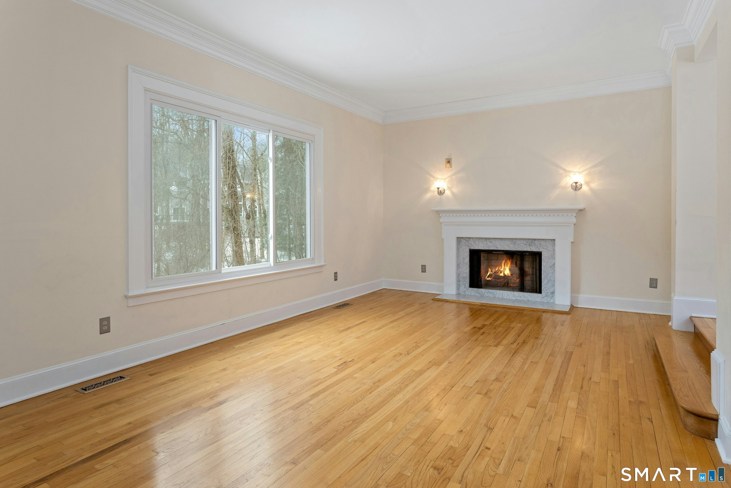 6 Morganti Court Ridgefield, CT 06877 - Photo 25 of 36 a view of empty room with wooden floor and fireplace