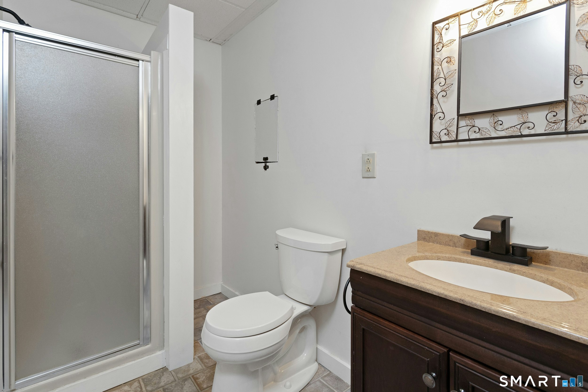 6 Morganti Court Ridgefield, CT 06877 - Photo 29 of 36 a bathroom with a sink toilet and mirror