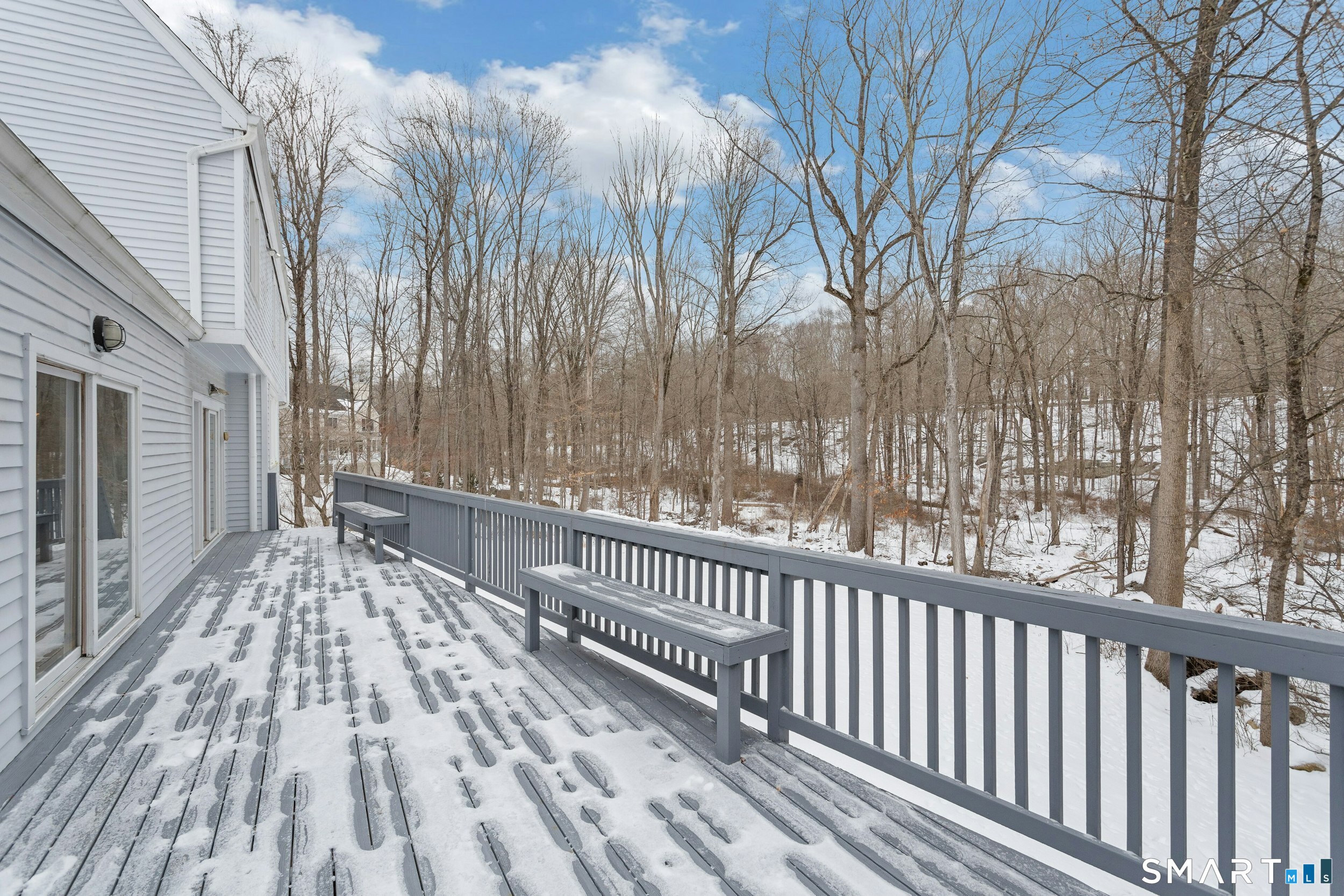 6 Morganti Court Ridgefield, CT 06877 - Photo 30 of 36 a view of balcony with wooden floor and fence