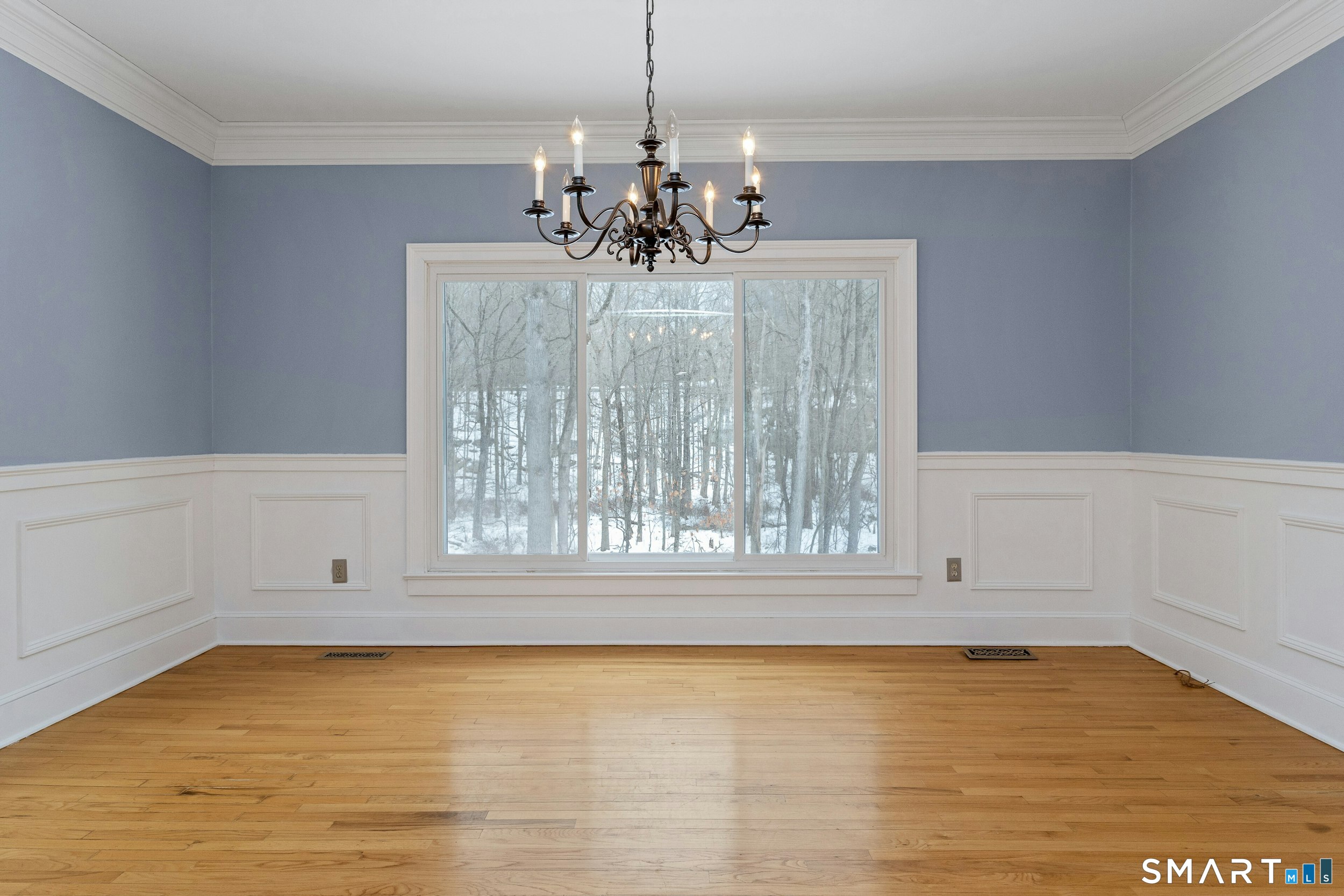6 Morganti Court Ridgefield, CT 06877 - Photo 27 of 36 a view of dining room with chandelier and wooden floor