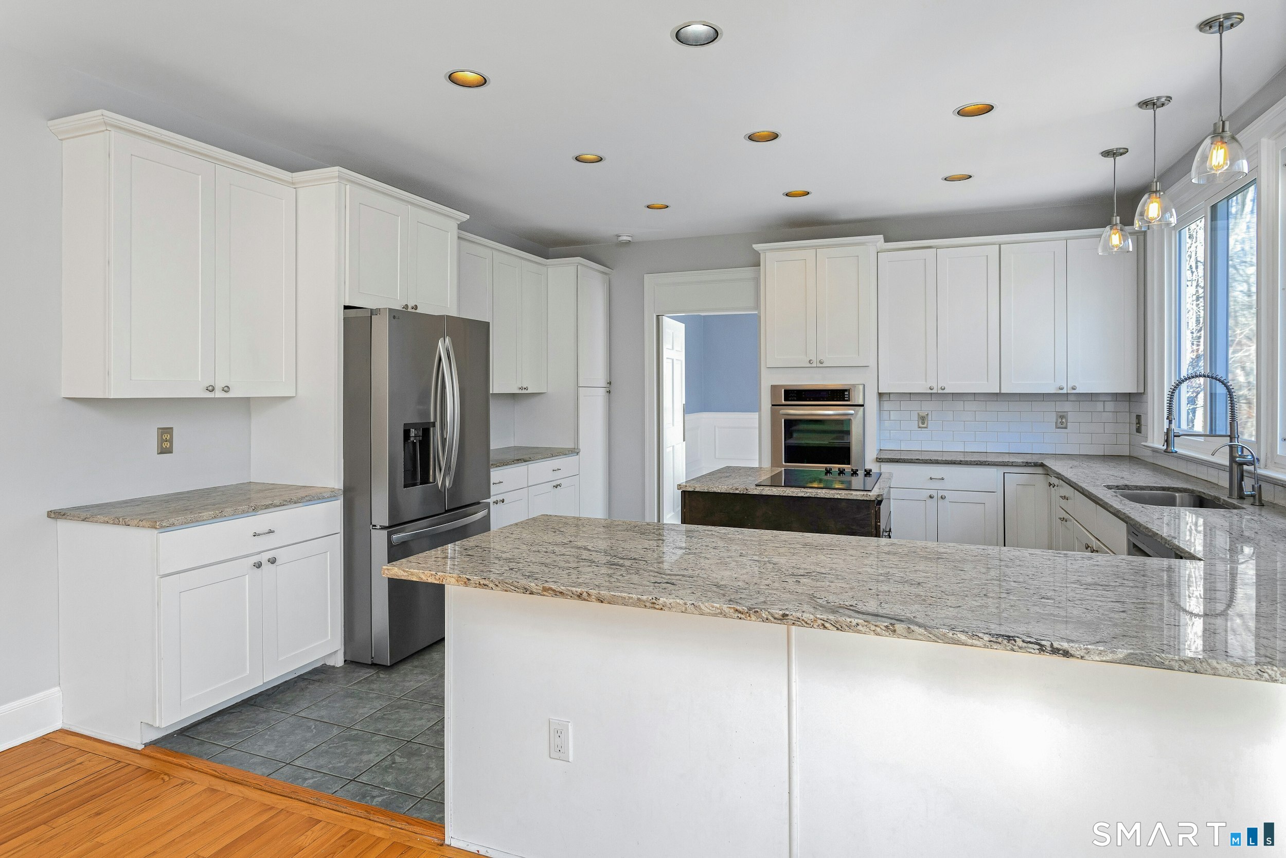 6 Morganti Court Ridgefield, CT 06877 - Photo 31 of 36 a kitchen with stainless steel appliances granite countertop a sink a stove a refrigerator a center island and cabinets