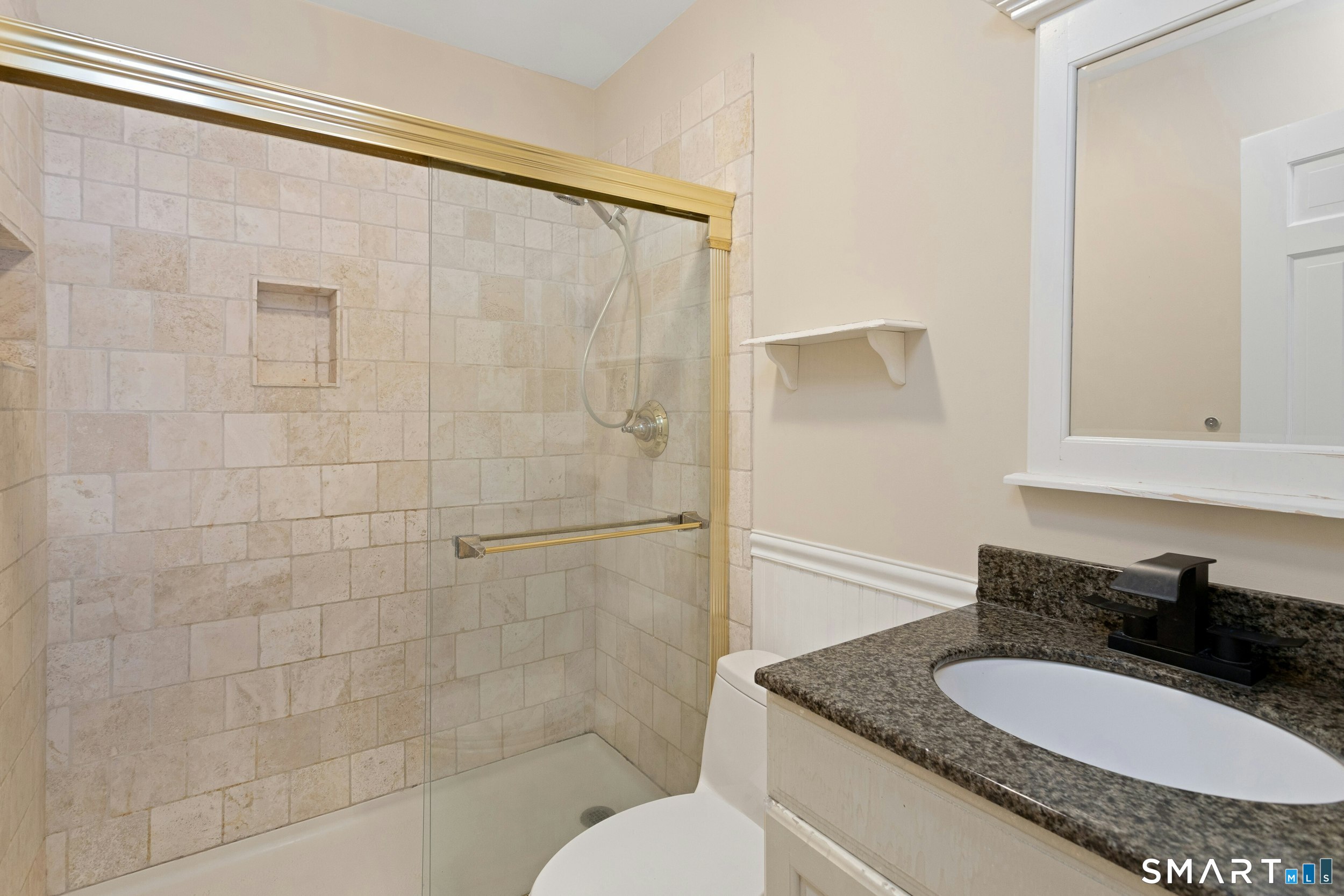 6 Morganti Court Ridgefield, CT 06877 - Photo 8 of 36 a bathroom with a granite countertop sink and a mirror