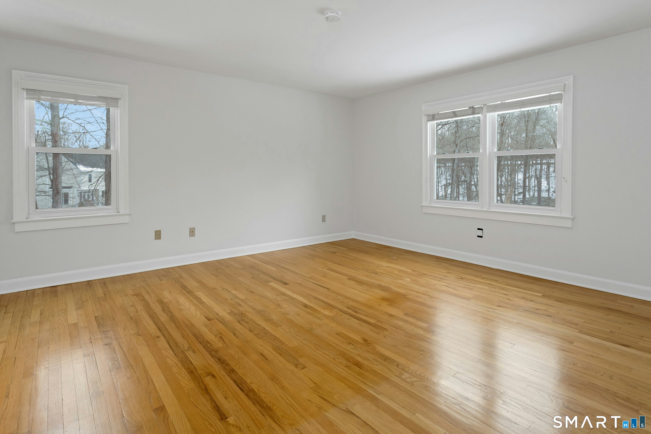 6 Morganti Court Ridgefield, CT 06877 - Photo 9 of 36 a view of empty room with wooden floor and fan
