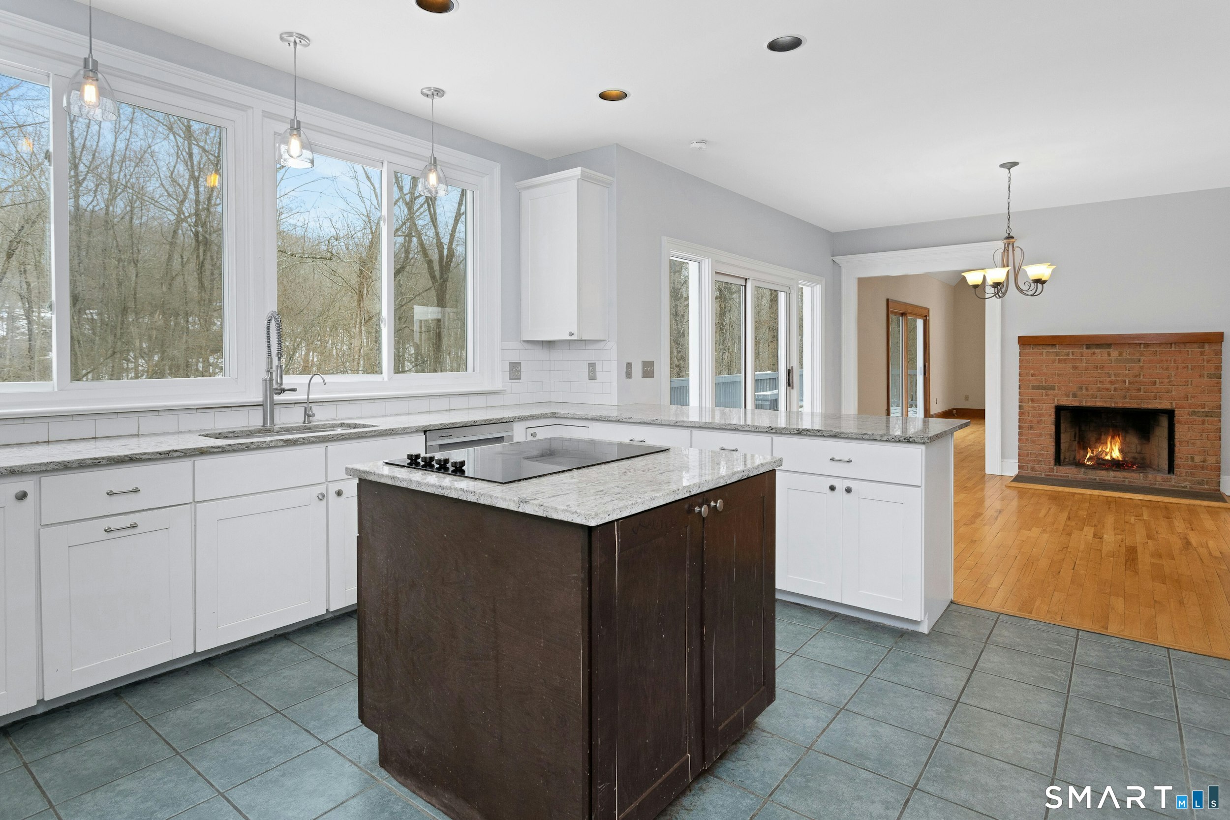 6 Morganti Court Ridgefield, CT 06877 - Photo 10 of 36 a kitchen with a sink stove and cabinets