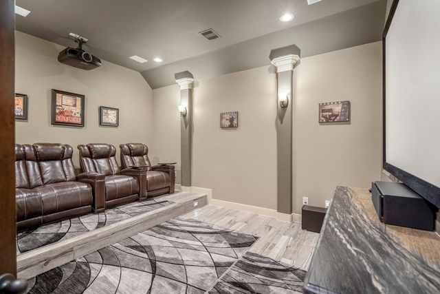 a bed room with a bed and a chandelier