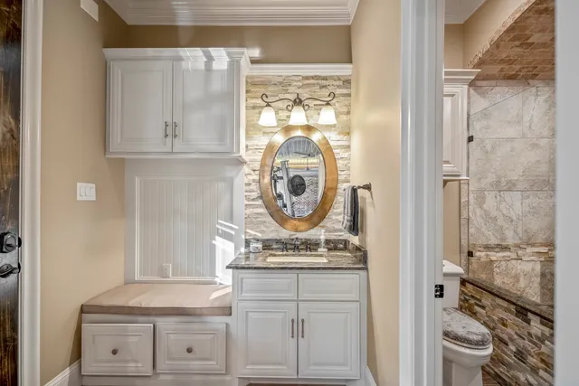 a view of a livingroom with a window and a ceiling fan