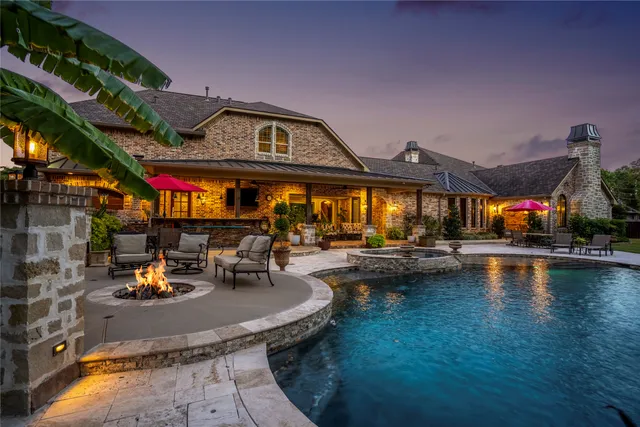 a view of a swimming pool with a patio