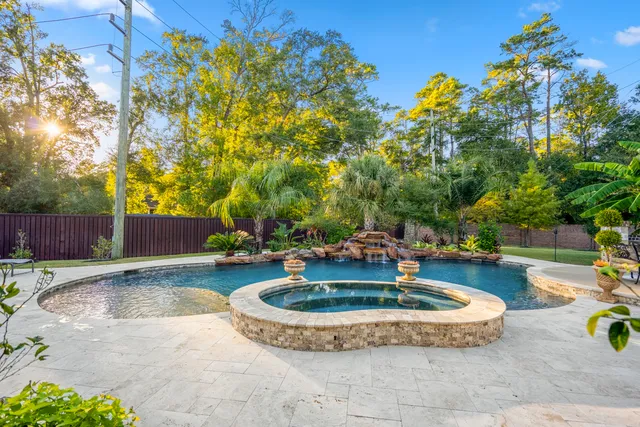 a view of a swimming pool with a patio