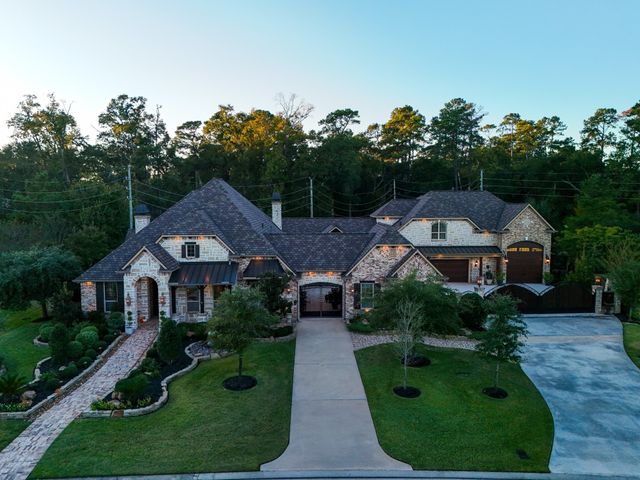 an aerial view of residential houses with outdoor space and street view