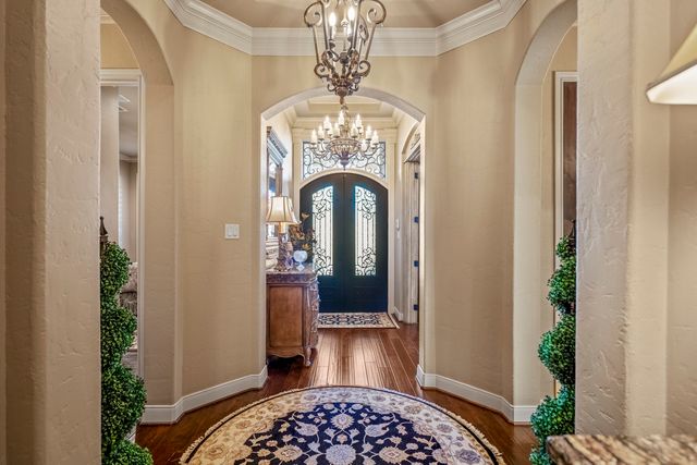 a kitchen with stainless steel appliances granite countertop a stove and a refrigerator