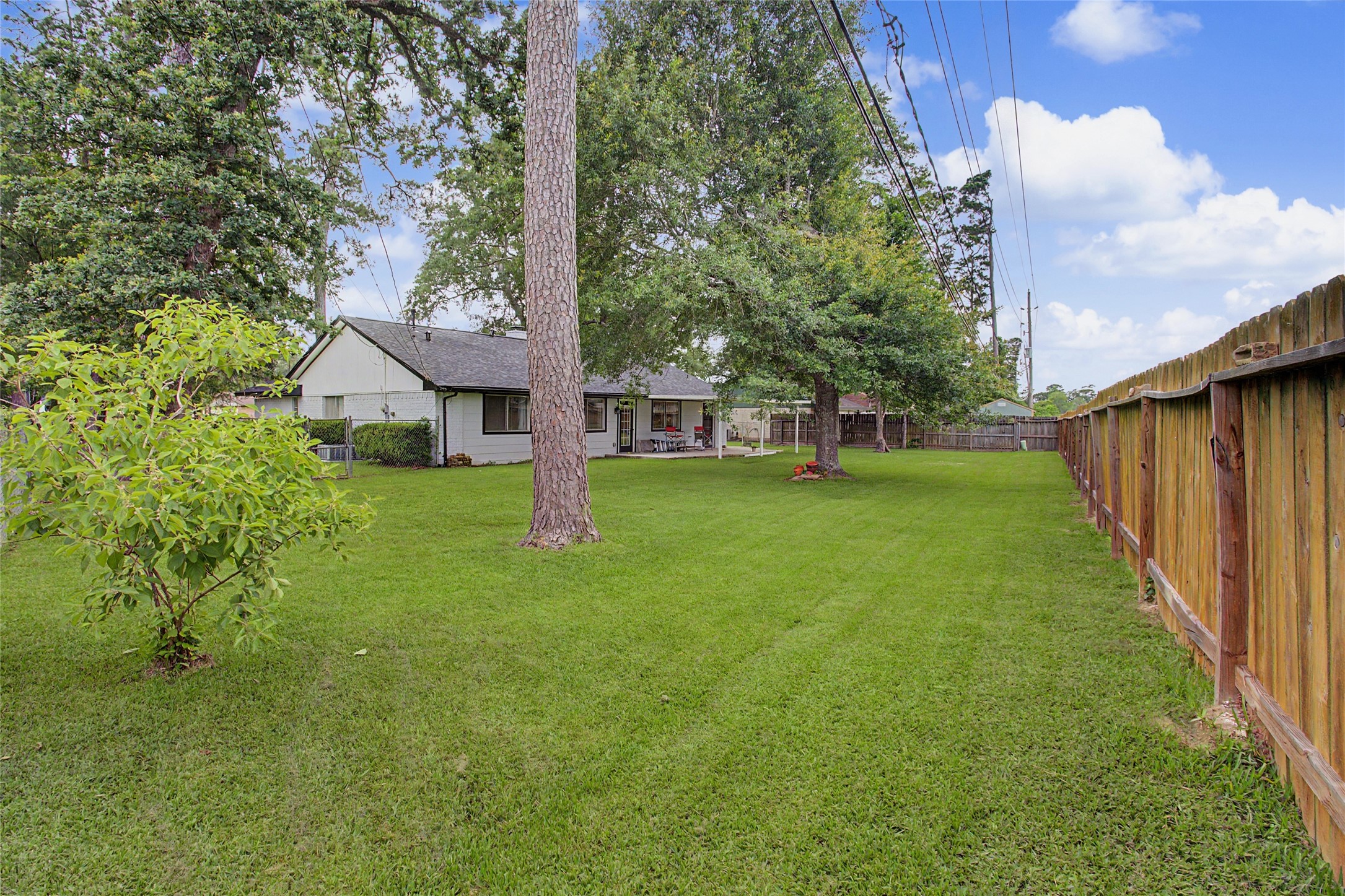 327 Fir Ridge Drive Huffman, TX 77336 - Photo 21 of 25 Mature trees in this oversized backyard