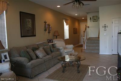20244 Larino Loop Estero, FL 33928 - Photo 3 of 10 a living room with furniture and a chandelier