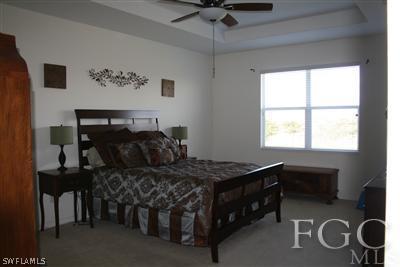 20244 Larino Loop Estero, FL 33928 - Photo 5 of 10 a bedroom with a bed and a window