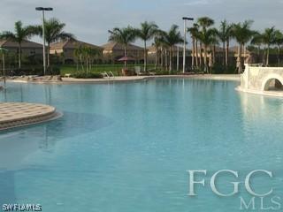 20244 Larino Loop Estero, FL 33928 - Photo 8 of 10 a view of a swimming pool and lounge chair