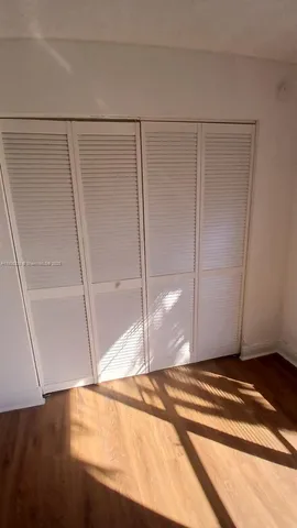 a bathroom with a white bath tub a toilet and a shower