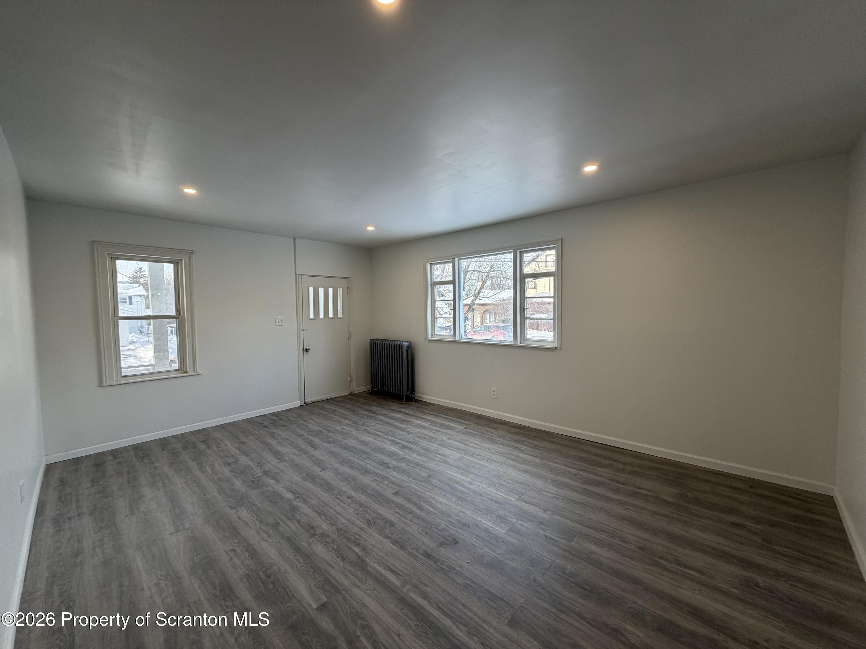 101 Clarkson Street, Unit 1 Jessup, PA 18434 - Photo 6 of 13 an empty room with windows