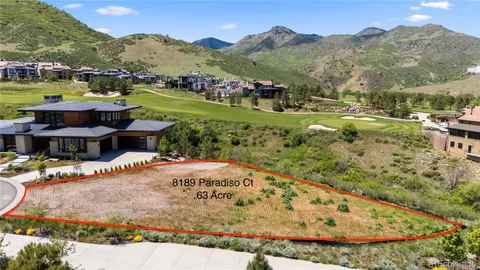 a view of a swimming pool with a yard and mountain