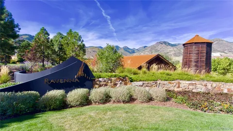 a view of a bench in middle of the green field