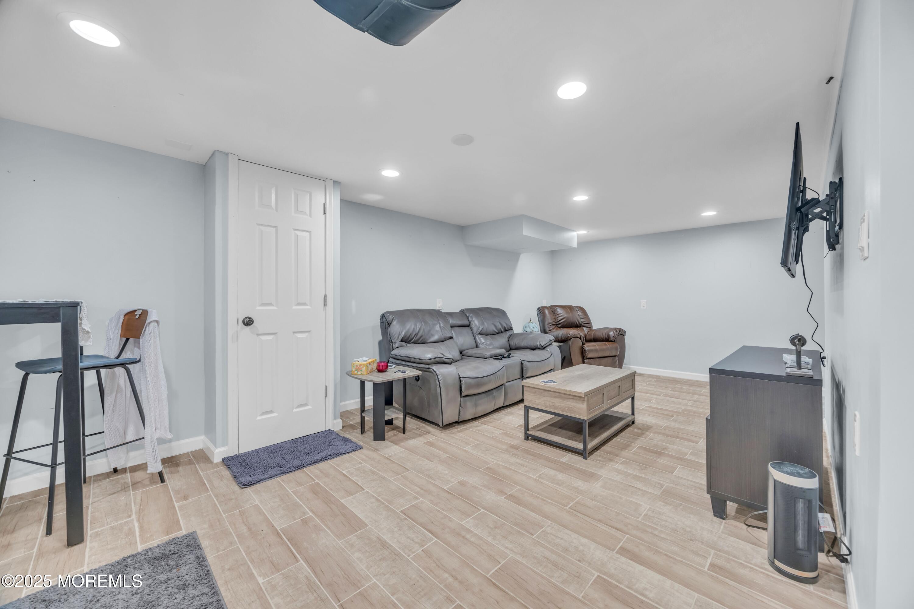 75 Ridgewood Road Clifton, NJ 07012 - Photo 20 of 41 a living room with furniture and a wooden floor
