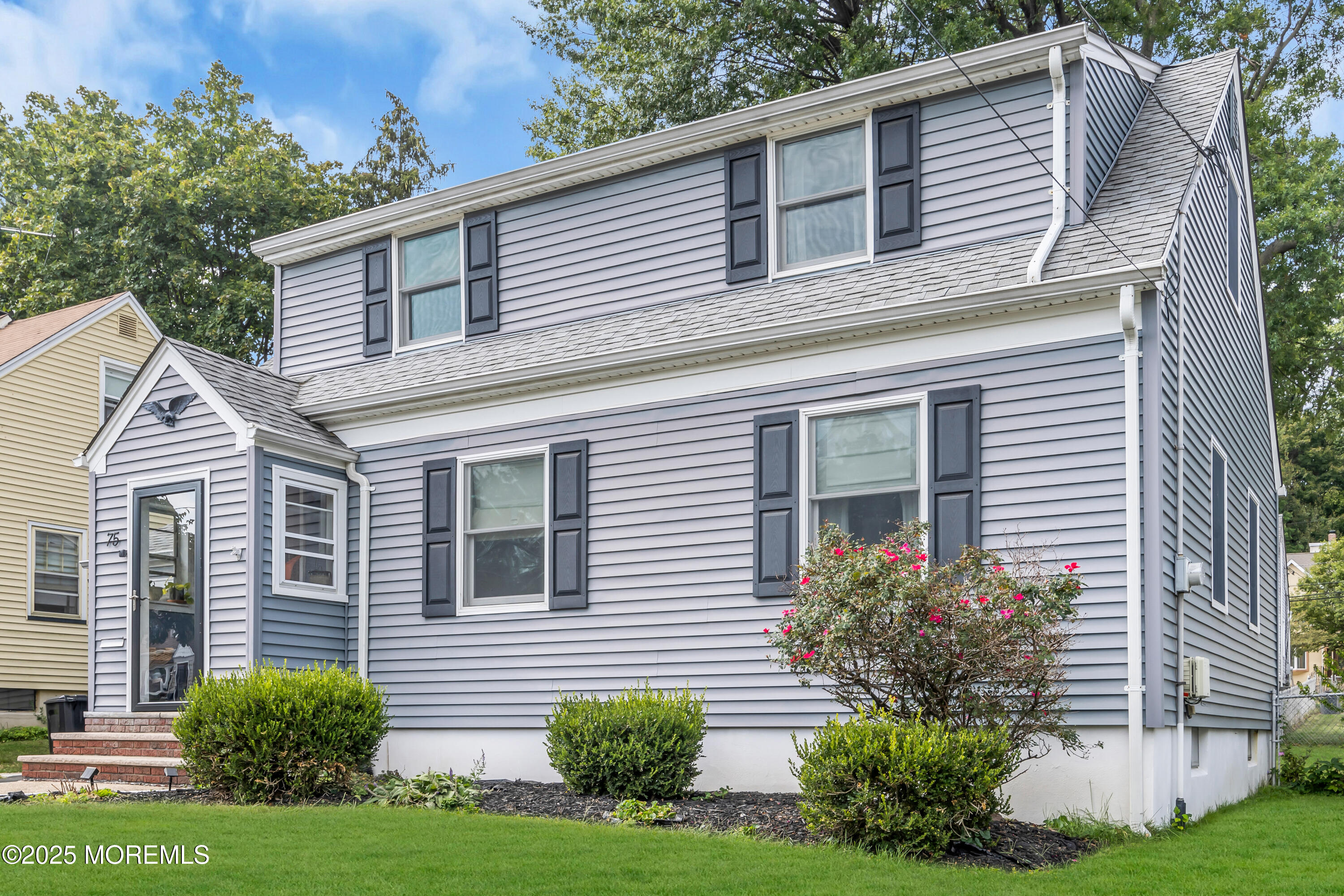 75 Ridgewood Road Clifton, NJ 07012 - Photo 2 of 41 a view of a house with a yard and plants
