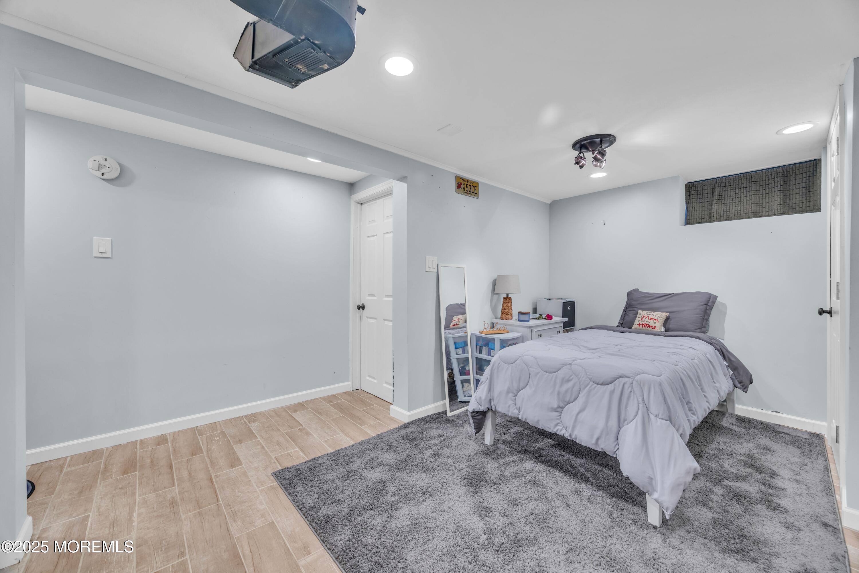 75 Ridgewood Road Clifton, NJ 07012 - Photo 22 of 41 a bedroom with a bed and a ceiling fan