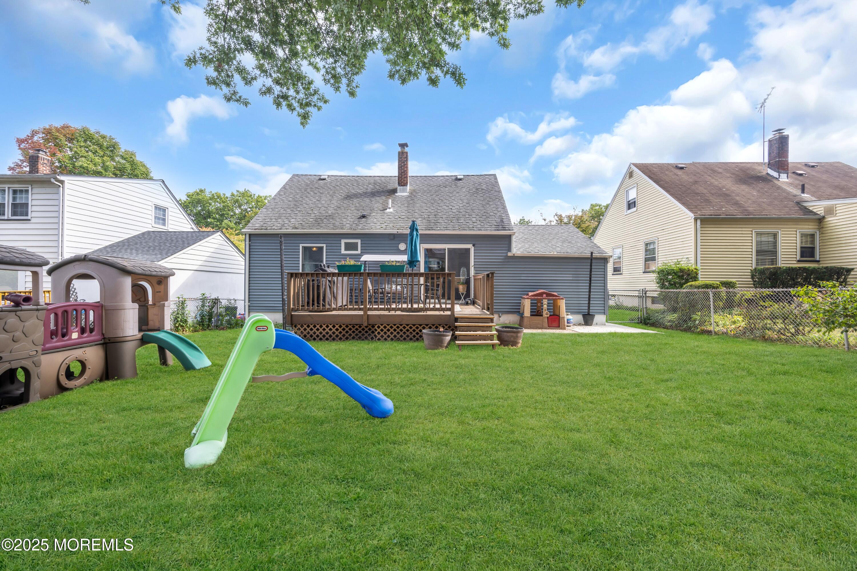 75 Ridgewood Road Clifton, NJ 07012 - Photo 27 of 41 a front view of a house with a yard and a large tree