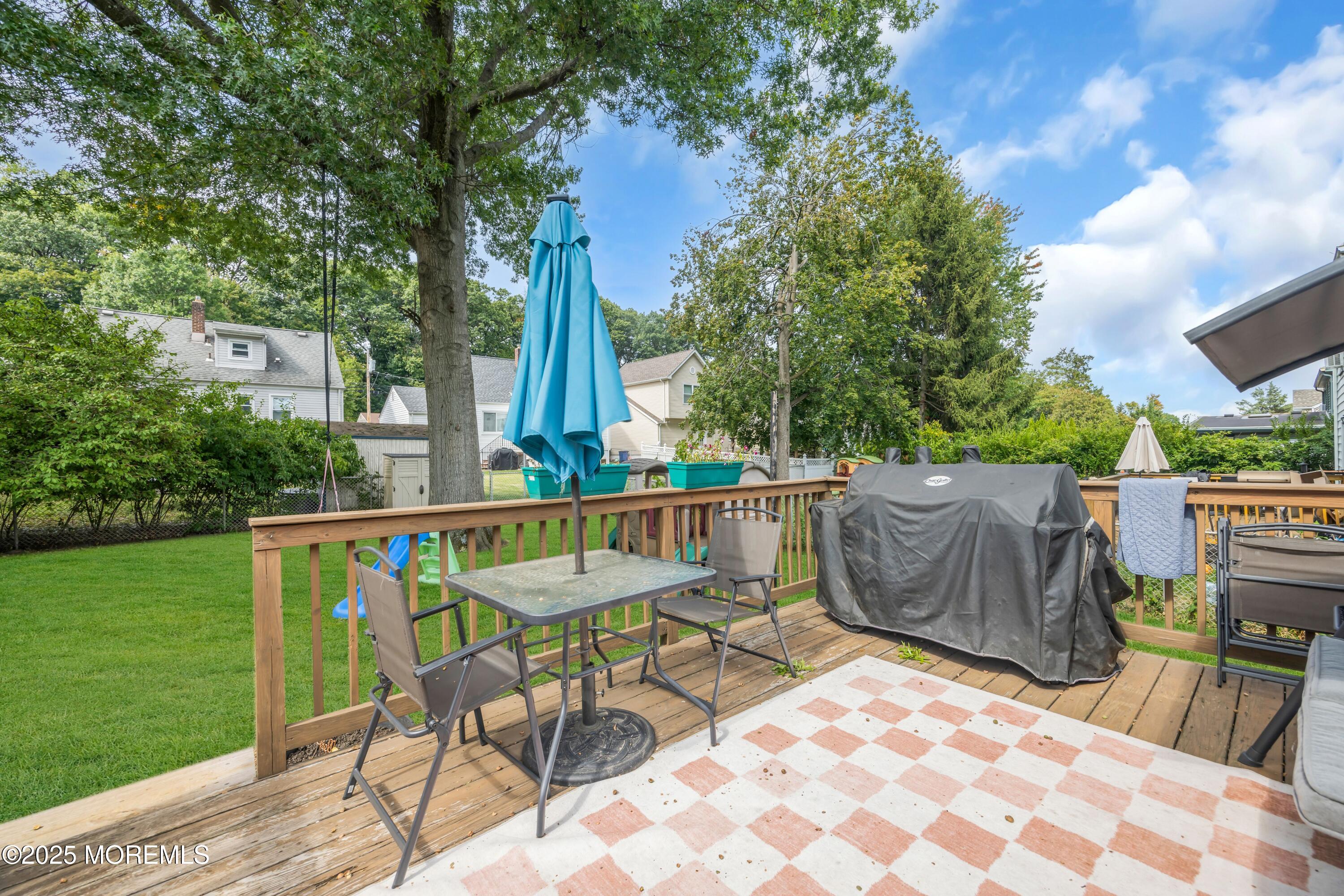 75 Ridgewood Road Clifton, NJ 07012 - Photo 30 of 41 a view of balcony with wooden floor and outdoor seating