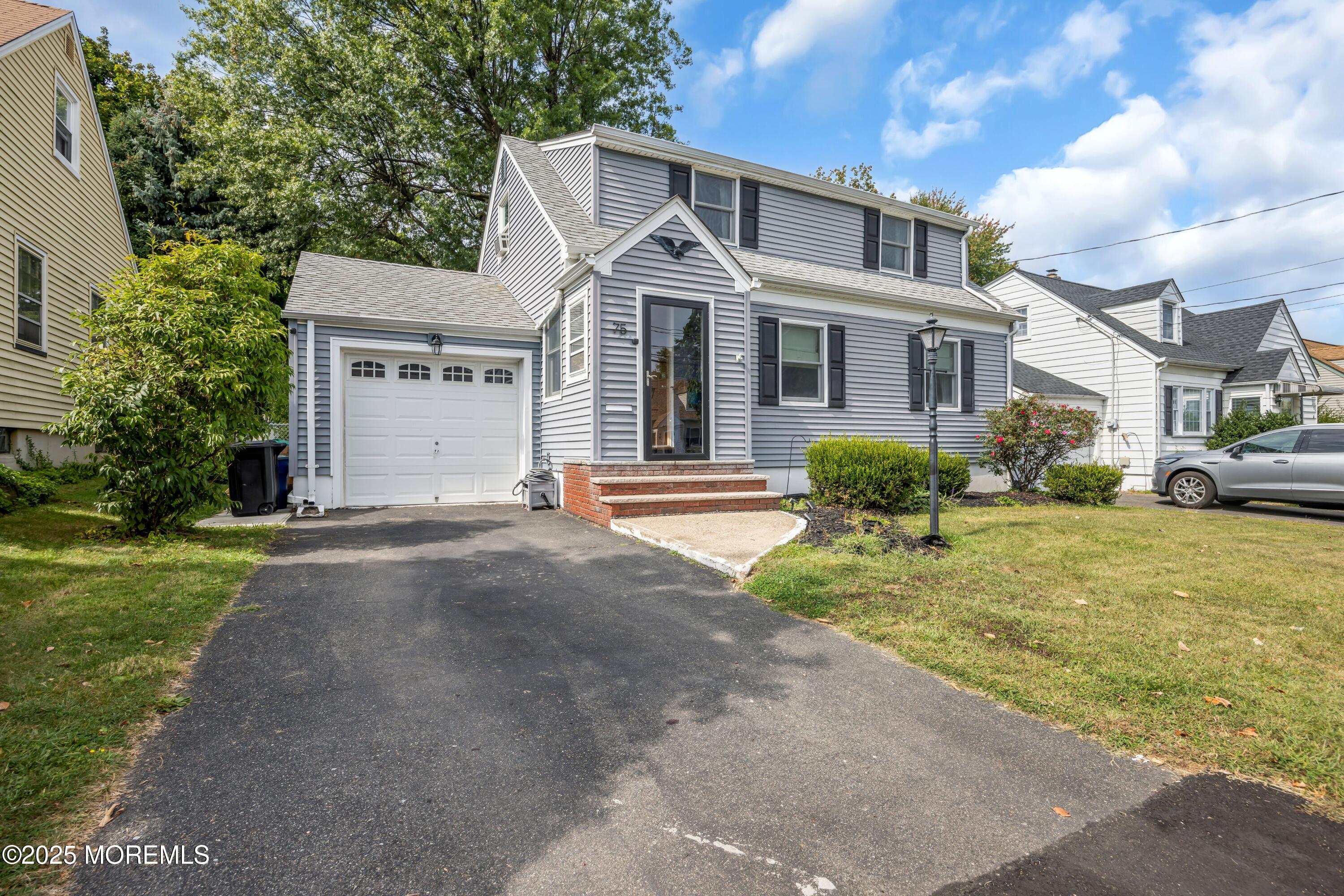 75 Ridgewood Road Clifton, NJ 07012 - Photo 31 of 41 a front view of a house with a garden