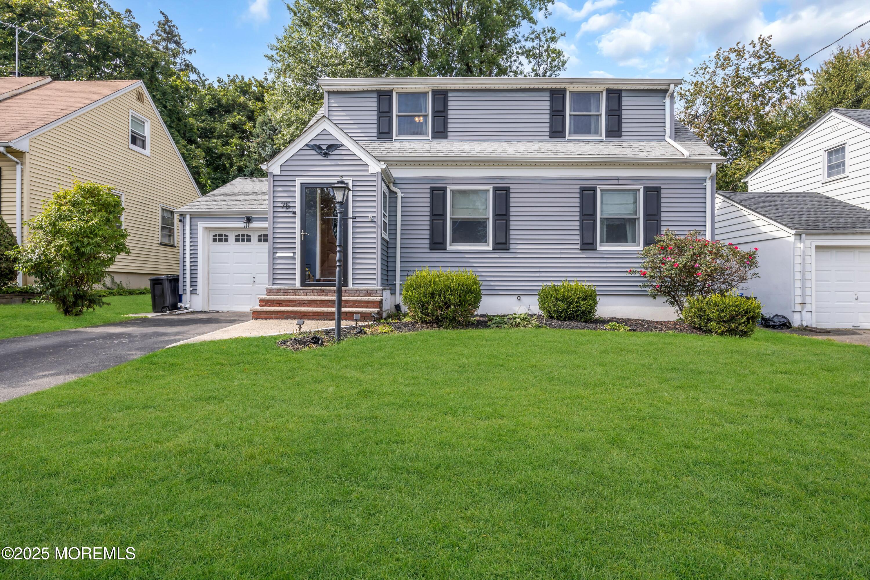 75 Ridgewood Road Clifton, NJ 07012 - Photo 34 of 41 a front view of a house with a yard and green space