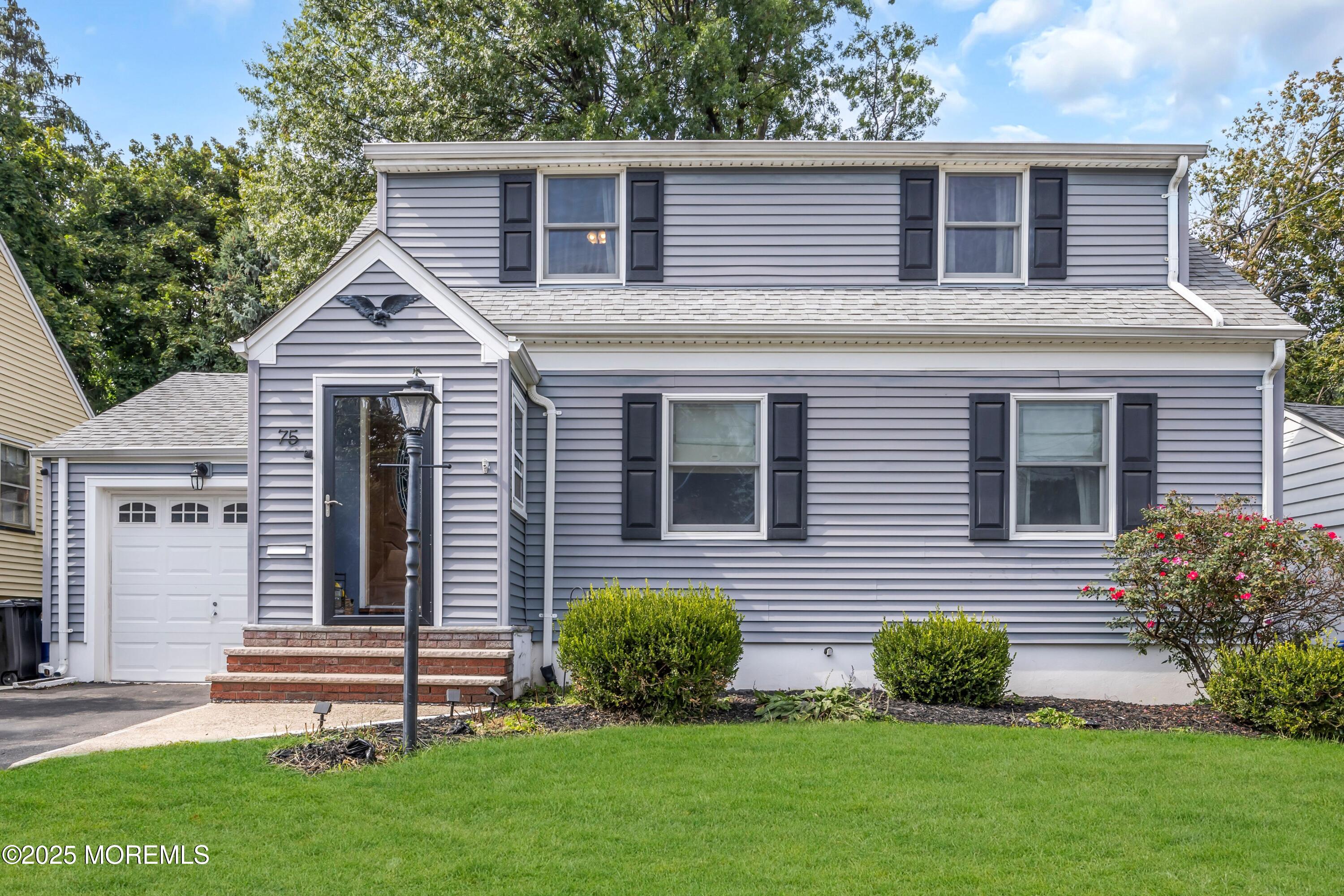 75 Ridgewood Road Clifton, NJ 07012 - Photo 35 of 41 a front view of a house with a garden