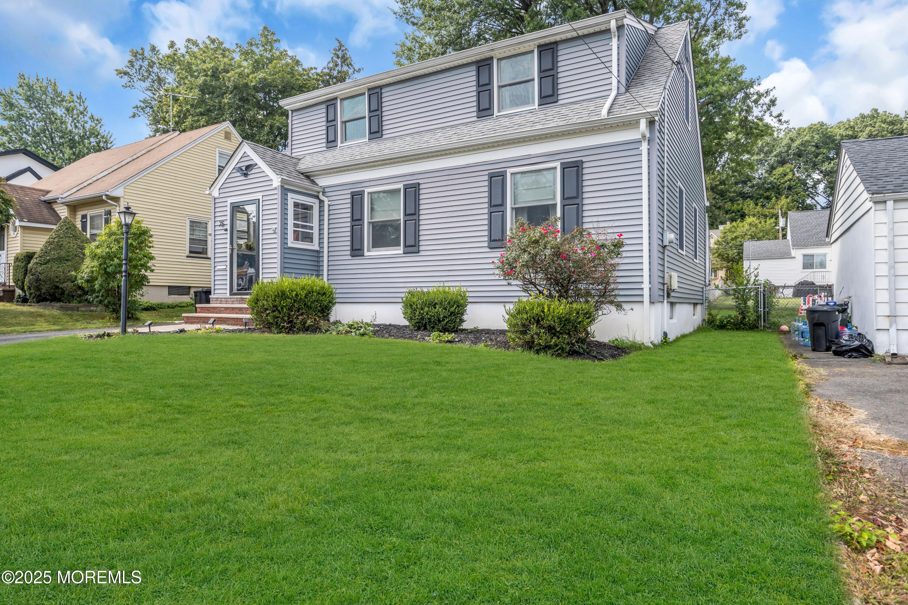 75 Ridgewood Road Clifton, NJ 07012 - Photo 36 of 41 a front view of a house with a garden