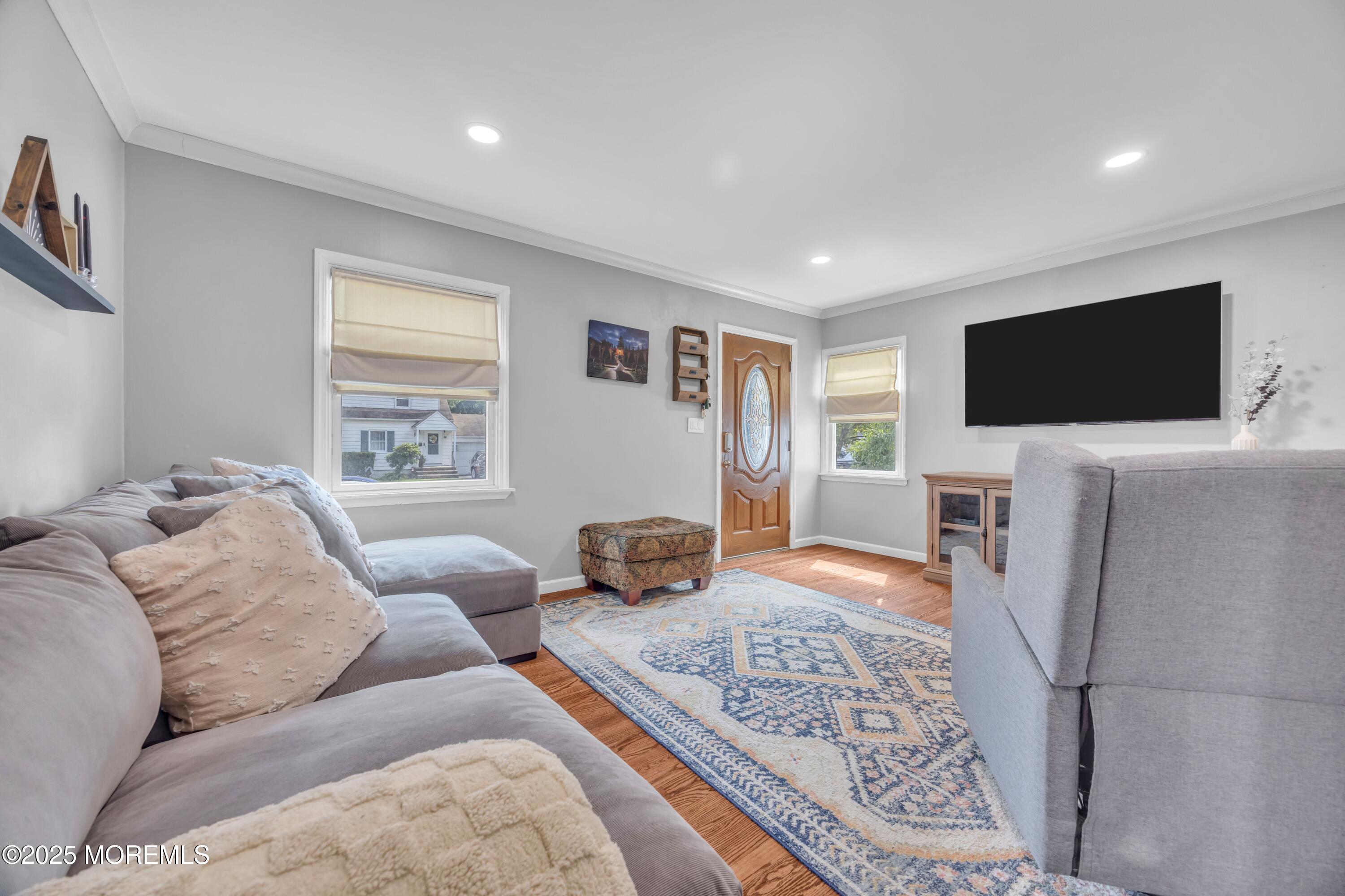 75 Ridgewood Road Clifton, NJ 07012 - Photo 6 of 41 a living room with furniture and a flat screen tv